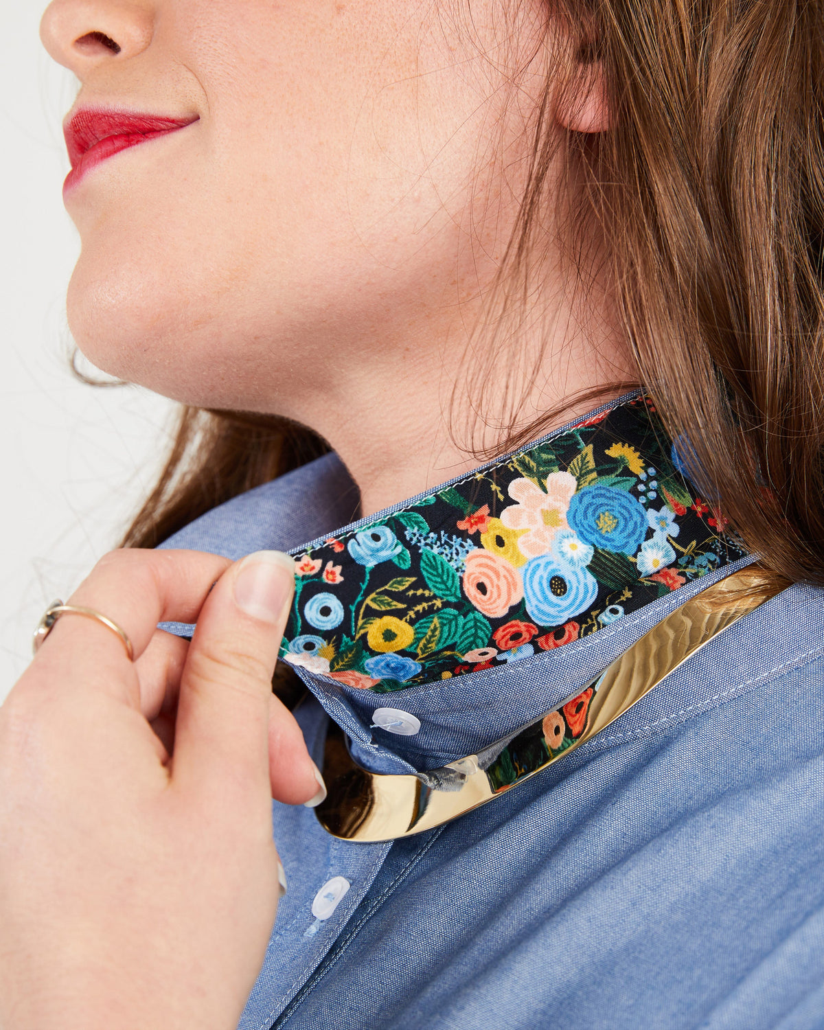 Person wearing a floral-patterned choker on a plain background. This button-up shirt is the Harrison Shirt sewing pattern from Cashmerette.