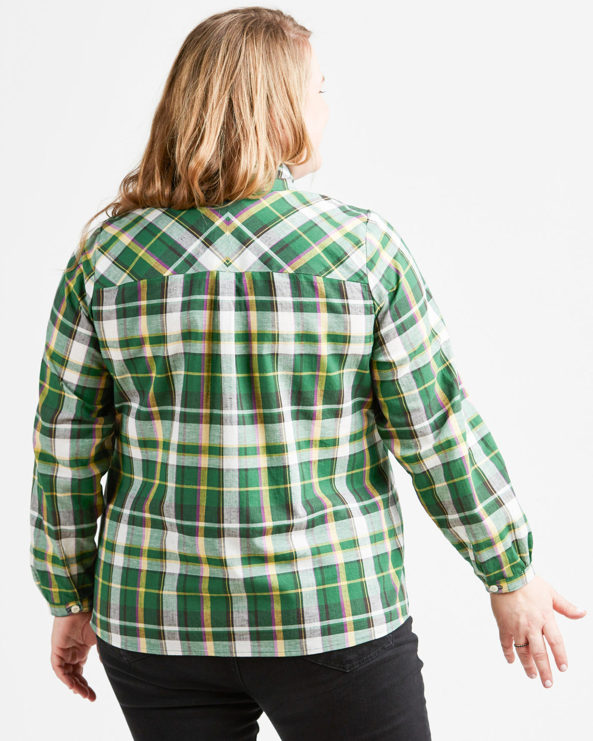 Person wearing a green plaid shirt on a white background. This top is the Vernon Shirt sewing pattern from Cashmerette.