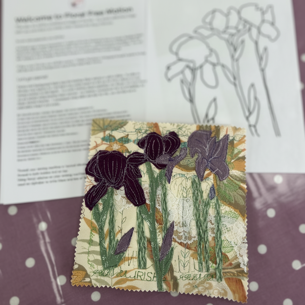 A floral free motion quilting kit layout featuring a printed welcome guide, an iris line art pattern sheet, and a finished quilted fabric patch of purple and green irises on a purple polka dot background.