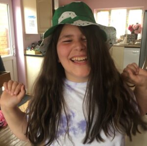 Happy Girl in Green Hat