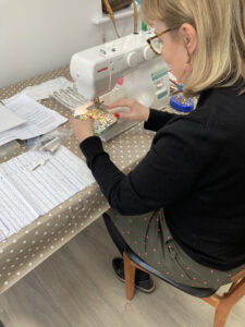 Lady on sewing machine