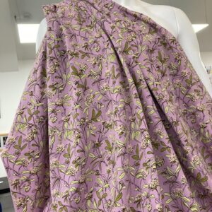 Cotton Jersey lycra 2 way stretch with good recovery.  Violet with floral design, sold per meter, suitable for sewing t-shirts, dresses, trousers. 